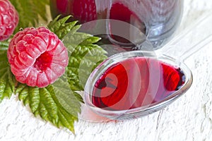 Raspberry syrup on spoon alternative medicine