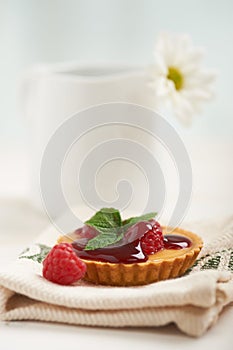 Raspberry tart on a napkin