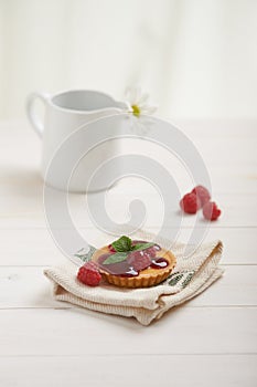 Raspberry tart on a napkin