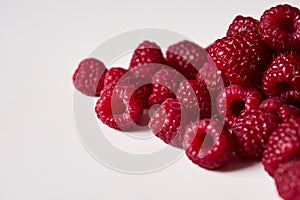 Raspberry on a white background, close-up red