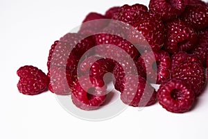 Raspberry on a white background, close-up red