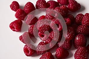 Raspberry on a white background, close-up red