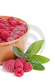 Raspberry in wooden plate