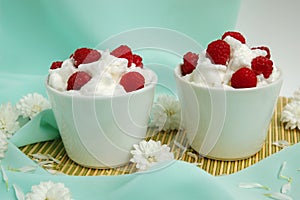 Raspberrys with white whipped cream