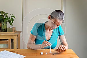 RAT test at home. Step 5. Insert the swab into the tube until the soft pad is in the liquid.