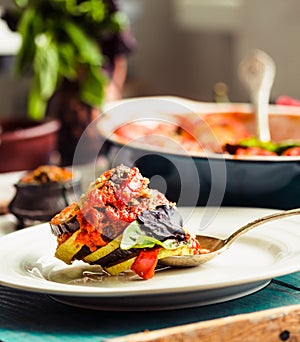 Ratatouille - a classic vegetarian dish from French cuisine. Baked vegetables in tomato sauce with basil and paprika. Comfort veg