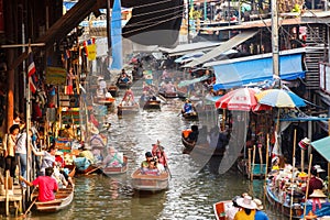 Ratchaburi ,Thailand- March 20 2016 : Damnoen Saduak Floating Market, tourists visiting by boat, located in Ratchaburi, Thailand