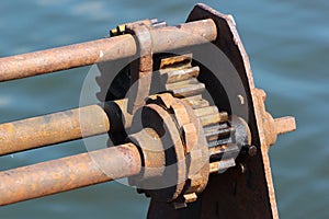 Ratchet and pawl mechanism of old rusty winch on a pier photo