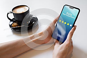 Rate your experience customer satisfaction review Five Stars on mobile phone screen. Business technology concept.