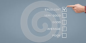 Rating excellent. Quality survey. giving excellent feedback rating as oppose to Good, Average and Poor ratings. hand with pencil