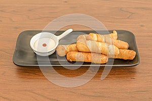 Ration of delicious tequeÃ±os stuffed with cheese fried with mayonnaise