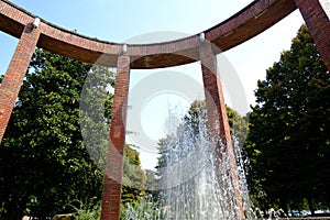 Rationalist pavilion with brick colonnade. Designed by Giovanni Attilio Fugazza in the center of Lodi. Fountain with water jet