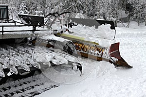 Ratrac. Ratrack, snow grooming machine prepares slopes for skiers on a ski resort in mountains. Ratrac machine for skiing slope pr