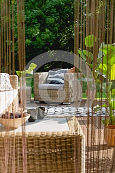 Rattan armchair in garden