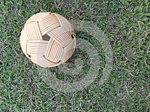 Rattan ball, takraw ball on green grass