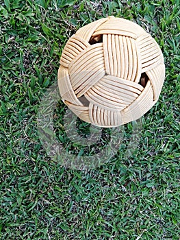 Rattan ball, takraw ball on green grass