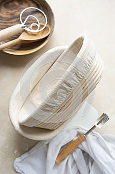 Rattan banneton, proofing basket for sourdough bread. Baking utensile. Basic set of baking bread at home photo