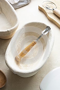 Rattan banneton, proofing basket for sourdough bread. Baking utensile. Basic set of baking bread at home photo