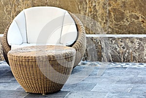Rattan chair on marble