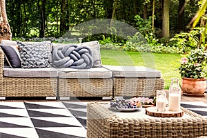 Rattan sofa in the garden