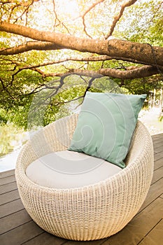 Cream sofa made of rattan in the natural relaxing corner.