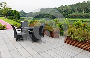 Rattan sofa and table set in a garden
