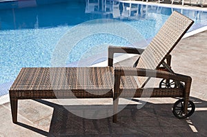 Rattan sun lounger with wheels