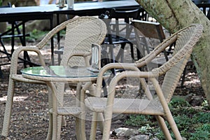 Rattan table and chairs in the garden.