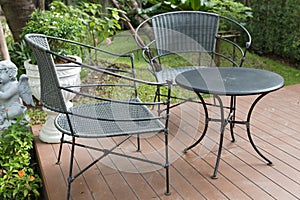 rattan wicker chair and desk on patio