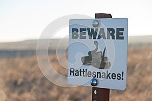 Rattle Snake Warning Sign in Badlands National Park in Spring