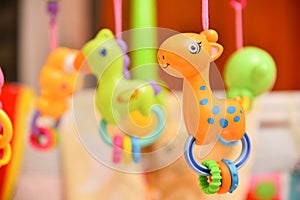 Rattles with music spinning above the baby\'s crib