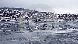 Reflections of Rattvik town in lake Siljan in Dalarna in Sweden photo