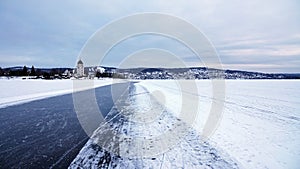 Rattvik kyrka on frozen lake Siljan in Dalarna in Sweden