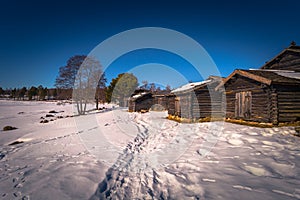 Rattvik - March 30, 2018: Wooden houses by the frozen lake Siljan in Rattvik, Dalarna, Sweden photo