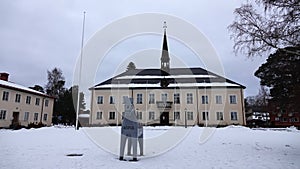Rattvikk townhall and Dalarna horse in winter in Sweden photo