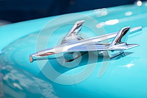 RATZEBURG, GERMANY - JUNE 3, 2019: Plane from chrome, the hood ornament of a Chevrolet automobile, classic Chevy Bel Air from 1956