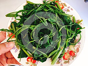 Rau muong or boiled vietnamese morning glory vegetables on dish