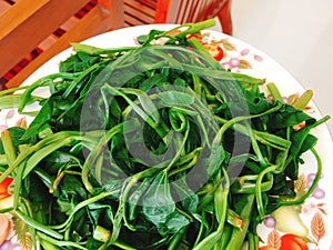 Rau muong or boiled vietnamese morning glory vegetables on dish