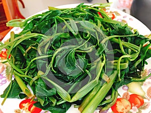 Rau muong or boiled vietnamese morning glory vegetables on dish