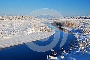 Raudna river and frozen Viljandi lake in cold and sunny winter day