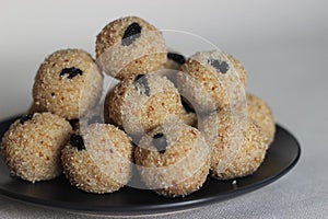 Rava laddu is a South Indian Sweet made with semolina, sugar, ghee, cashews and raisins