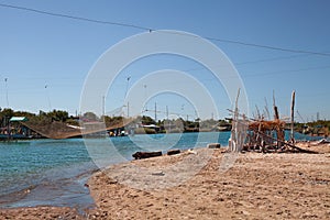 Ravenna, Emilia Romagna, Italy: landscape of the river mouth Fiumi Uniti with fishing huts and nets photo