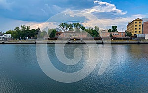 Ravenna, Italy: 10-04-2022: Beautiful buildings reflection on Ravenna`s darsena on a morning sunny day .