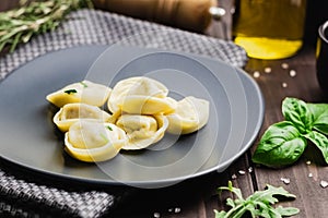 Ravioli with basilico and ground pepper. Winter recipes for the cold season of Italian cuisine, front view