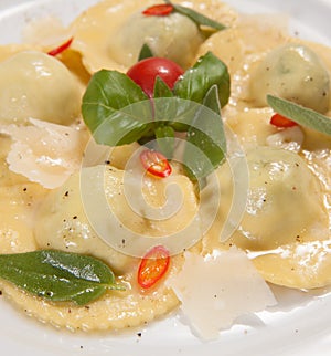 Ravioli with red chily pepper and sweet basil photo