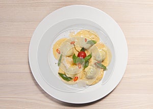 Ravioli with red chily pepper and sweet basil photo