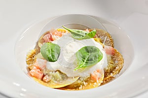 Ravioli with spinach, concasse and cheese espuma photo