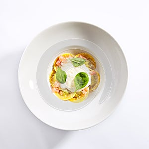 Ravioli with spinach, concasse and cheese espuma photo