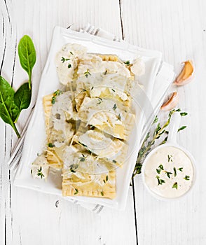 Ravioli with spinach and ricotta cheese on white plate