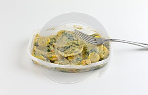 Ravioli with spinach TV dinner with a fork